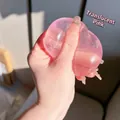 Close-up of a transparent pink squishy stress relief ball showing slow rebound texture. - Maltose Ball / 6cm / Baby Pink