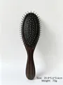 Detail of portable air cushion massage comb with silver needle teeth and wood grain handle - Black Brown