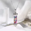 Close-up of cylindrical pendant necklace filled with colorful natural crystal chips - Colorful Stone