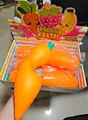 Oversized simulation carrot squishy stress relief toy being squeezed for detail demonstration - Carrot Squishy / Jumbo Size (1 Piece) / Orange