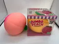Large pink jumbo peach squishy toy next to retail packaging strawberry scented toy - Pink Peach Squishy / Jumbo Size (1 Piece) / Pink