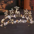 Detail view of a golden princess crown with crystal deer and pearls for girls' birthdays. - Golden Forest Deer Style (HG018)