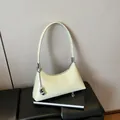Chic cream yellow minimalist underarm shoulder bag with a stylish metallic bean pendant - With Pendant / Green
