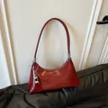 Retro glossy red underarm shoulder bag featuring silver charm and minimalist zipper design - With Pendant / Burgundy