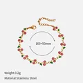 Gold plated stainless steel cherry charm bracelet with pink glitter and green leaves detail - Pink