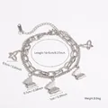 Bracelet double couche en acier titane argenté avec breloques papillons dépolies et évidées - Argent