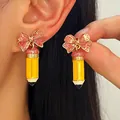 Kreative Bleistift-Ohrringe mit rosa Glitzerschleife und gelber Emaille-Oberfläche. - 08 Gelb (2719)