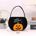 Round black plush Halloween candy bag with pumpkin applique and handle - Round Black Pumpkin