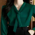 Elegant emerald green satin V-neck blouse with tie-neck detail and long sleeves. - XS / Tops / Green