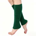 Close-up of deep green knitted leg warmers with ribbed texture for winter season - One Size / Bottoms / Dark Green