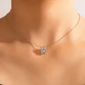 Minimalist silver-tone clavicle necklace featuring a single round cubic zirconia pendant. - Round Rhinestone Pendant Necklace (18752)