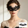 Elegant black lace masquerade eye mask shown worn by a model with a flat lay detail view - 04-Flame Top
