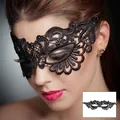 Close-up detail of an elegant black lace masquerade mask with intricate floral embroidery - 14-Ripple