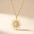 Close-up of gold alloy sun pendant necklace with moon and star details and rhinestones - Water Wave Chain Sunflower Necklace / Gold