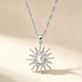 Close-up detail of silver sun moon and star pendant necklace with sparkling rhinestones - Water Wave Chain Sunflower Necklace / White Gold