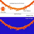 2m orange fluorescent star tinsel garland shown for neon party decor under UV light - 2m / Fluorescent Macaron Orange-Red Star Garland