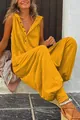 Vibrant yellow sleeveless hooded jumpsuit with button down detail and loose harem fit - S / Jumpsuits / Yellow