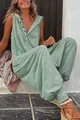 Detail view of a sage green sleeveless hooded jumpsuit with button front - Fluorescent Green