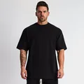 Heren oversized zwart katoenen sport t-shirt voor fitness, hardlopen en sportschool - M / Tops / Zwart (Geen Logo)