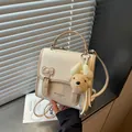 Stylish cream woven women's backpack with cute teddy bear charm and bow buckle detail - Rice White (with Pendant)