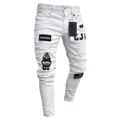 Detail view of men's white distressed skinny jeans with stylish hip hop embroidered patches - S / White