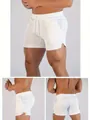 Men's white mesh gym shorts featuring front side and back views for athletic training - M / Bottoms / White