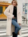 Elegant long cream faux fox fur coat for women styled in an urban winter street setting - Apricot
