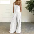 Dettaglio di una tuta bianca senza maniche a gamba larga con bottoni laterali e tasche - Taglia S / Top E Pantaloni / Bianco