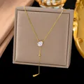 Elegant gold Y-necklace with pear-shaped clear stone and teardrop pendant detail - White Rhinestone Waterdrop Style (H1216)