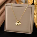 Gold necklace with rocking horse pendant and coin charm on jewelry box - Horse and Coin Style (H1146)