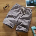 Grey casual cotton linen shorts for men featuring elastic drawstring waist and wooden beads. - M / Bottoms / Gray