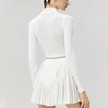 Detailed back view of white pleated tennis dress with breathable mesh panel for women - XS / Long-sleeved Top And Bottom / White