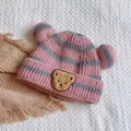 Cute pink and grey striped knitted baby beanie featuring bear ears and an embroidered patch - One Size / Striped Bear Kids / Pink