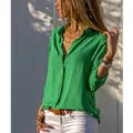 Detail view of stylish green button-up blouse with deep V-neck for women - S / Tops / Green