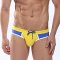 Men's quick-dry swim trunks in yellow and blue color-blocked design with drawstring. - M / Bottoms / Yellow