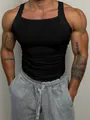Macro view of men's black ribbed slim fit fitness tank top showing muscle definition - S / Tops / Black