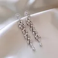 Detailed view of elegant silver vine dangle earrings with sparkling marquise crystals - A788 Silver Tassel Leaf Vine Dangle Earrings