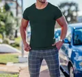 Detail view of the dark green ribbed texture on a men's slim-fit crew neck T-shirt - Dark Green