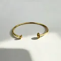 Detailed view of 18K gold plated stainless steel cuff bracelet with pearl settings - DIY Blank Setting (No Stone) / Gold