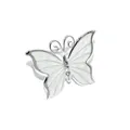 Close-up detail of a silver-toned butterfly napkin ring with cream enamel wings decoration - Butterfly / Silver