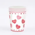 Detail of Valentine's Day pink heart disposable paper cups for party table decoration. - Paper Cups (16 Pack) / Pink Heart