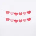 Close-up detail of a pink and red paper heart banner for Valentine's Day party decorations - Birthday Banner (1 Pack) / Pink Heart