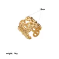 Detailed macro view of wide gold stainless steel geometric chain link ring, 1.8cm width - Geometric Interwoven Chain Style (Style 5)