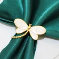 Elegant golden dragonfly napkin ring with beige enamel wings on green satin cloth - Dragonfly / Gold