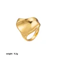Detail view of an exaggerated golden stainless steel ring with a wavy petal-like surface. - Irregular Wave Petal Style (Style 28)