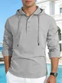 Detail of men's grey linen hooded shirt with buttoned Henley neckline and texture. - S / Tops / Gray
