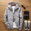 Men's lightweight grey hooded jacket in breathable fabric for casual outdoor wear - Gray