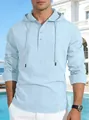 Detail shot of light blue cotton linen hooded shirt on a male model outdoors - Light Blue