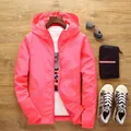 Vibrant pink lightweight men's hooded windbreaker jacket designed for active outdoor wear - Peach