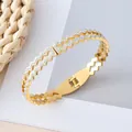 Eleganter goldener Zickzack-Armreif aus Titanstahl mit funkelnden Steinen für Damen - Zickzack Hohl Stil / Gold